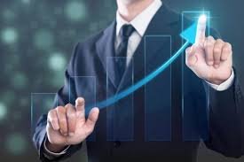 A businessman touching a rising digital growth graph, symbolizing improved business performance through services offered by a digital marketing agency in Faridabad.